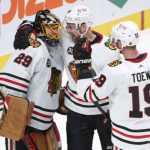 
              Chicago Blackhawks' Calvin de Haan, center, and Jonathan Toews congratulate goaltender Marc-Andre Fleury for his 500th career NHL win, after shutting out the Montreal Canadiens 2-0 in an NHL hockey game in Montreal on Thursday, Dec. 9, 2021. (/Paul Chiasson/The Canadian Press via AP)
            