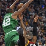 
              Boston Celtics center Al Horford (42) is called for a foul as he stops Utah Jazz guard Donovan Mitchell (45) from scoring during the first half of an NBA basketball game Friday, Dec. 3, 2021, in Salt Lake City. (AP Photo/Rick Egan)
            