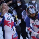 
              Kaillie Humphries, left, and Sylvia Hoffmann of the United States react after the women's two-women bobsleigh World Cup race in Igls, near Innsbruck, Austria, Sunday, Nov. 21, 2021. (AP Photo/Matthias Schrader)
            