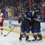 
              St. Louis Blues' Colton Parayko (55) is congratulated by teammates after scoring a goal during the second period of the team's NHL hockey game against the Detroit Red Wings on Thursday, Dec. 9, 2021, in St. Louis. (AP Photo/Scott Kane)
            