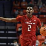 
              Rutgers' Jalen Miller signals a play during the second half of the team's NCAA college basketball game against Illinois on Friday, Dec. 3, 2021, in Champaign, Ill. (AP Photo/Michael Allio)
            