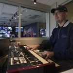 
              FILE - Atlanta Braves' organist Matthew Kaminski plays an organ overlooking Truist Field before Game 4 of baseball's World Series between the Houston Astros and the Atlanta Braves Oct. 30, 2021, in Atlanta. The jazz lover's eclectic taste in music, and his hilarious selections when opposing players come to the plate, set up a game within every game. For the first time ever, we'll be awarding a Newby Grammy to our top sports-related musician, Kaminski. (AP Photo/Brynn Anderson, File)
            