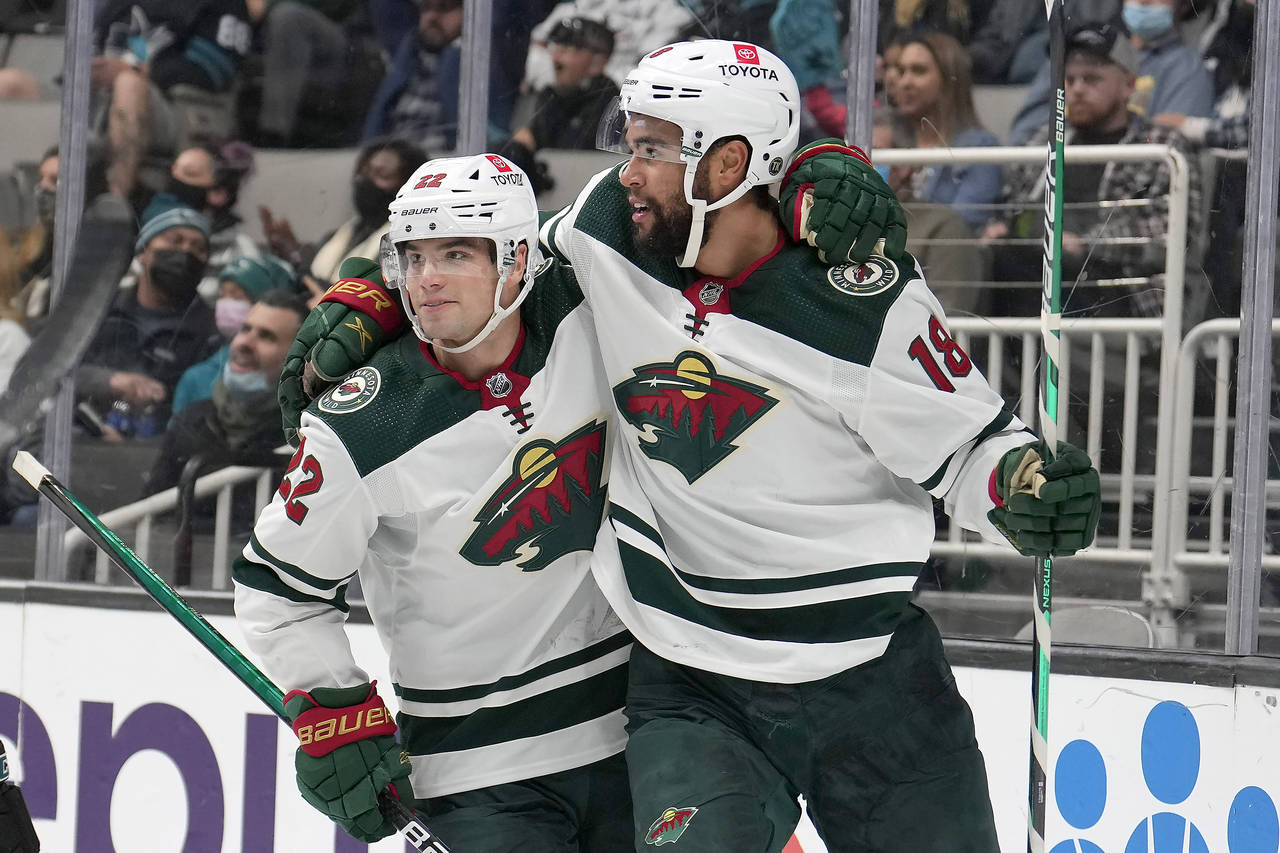 Minnesota Wild left wing Jordan Greenway (18) is congratulated by Kevin Fiala (22) after scoring a ...