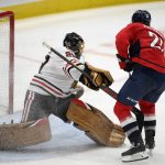 
              Washington Capitals right wing Garnet Hathaway (21) scores a goal against Chicago Blackhawks goaltender Marc-Andre Fleury (29) during the third period of an NHL hockey game, Thursday, Dec. 2, 2021, in Washington. The Blackhawks won 4-3 in a shootout. (AP Photo/Nick Wass)
            