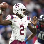 
              South Carolina State quarterback Corey Fields Jr. (2) passes during the first half of the Cricket Celebration Bowl NCAA college football game against Jackson State, Saturday, Dec.1 8, 2021, in Atlanta. (AP Photo/Hakim Wright Sr.)
            