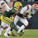 
              Green Bay Packers' Rashan Gary sacks Cleveland Browns' Baker Mayfield during the first half of an NFL football game Saturday, Dec. 25, 2021, in Green Bay, Wis. (AP Photo/Aaron Gash)
            