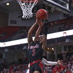 
              Arkansas State's Desi Sills (3) is fouled by Texas Tech's Kevin McCullar (15) during the first half of an NCAA college basketball game on Tuesday, Dec. 14, 2021, in Lubbock, Texas. (AP Photo/Brad Tollefson)
            