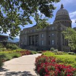
              FILE - The Idaho State Capitol in Boise, Idaho, is seen on June 13, 2019. An Idaho woman says her lawsuit challenging the state's ban on transgender athletes should continue moving through the court system because she is enrolled as a student at Boise State University and plans to play soccer on the school's club team next spring. Idaho passed the nation's first transgender sports ban last year, barring transgender women from playing on women's sports teams sponsored by public schools, colleges and universities. The law, dubbed House Bill 500 in court filings, doesn't affect transgender men playing on men's sports teams. (AP Photo/Keith Ridler, File)
            