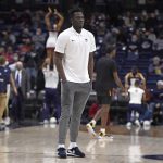 
              Connecticut's Adama Sanogo watches his team warm up before an NCAA college basketball game against Grambling State, Saturday, Dec. 4, 2021, in Storrs, Conn. (AP Photo/Jessica Hill)
            