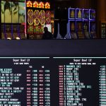 
              FILE - Betting odds for NFL football's Super Bowl 55 are displayed on monitors at the Circa resort and casino sports book, Wednesday, Feb. 3, 2021, in Las Vegas. (AP Photo/John Locher, File)
            