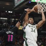 
              Milwaukee Bucks forward Giannis Antetokounmpo (34) drives to the basket as Miami Heat forward KZ Okpala (11) defends during the second half of an NBA basketball game, Wednesday, Dec. 8, 2021, in Miami. The Heat defeated the Bucks 113-104. (AP Photo/Marta Lavandier)
            