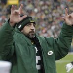 
              Green Bay Packers' Aaron Rodgers celebrates after throwing career touchdown pass 443 during the first half of an NFL football game against the Cleveland Browns Saturday, Dec. 25, 2021, in Green Bay, Wis. The pass breaks the previous Green Bay Packers record held by Brett Favre. (AP Photo/Aaron Gash)
            
