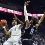 
              Kentucky's Tyty Washington Jr. (3) shoots while defended by Southern's Terrell Williams (0) during the first half of an NCAA college basketball game in Lexington, Ky., Tuesday, Dec. 7, 2021. (AP Photo/James Crisp)
            