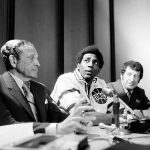 
              FILE - Spencer Haywood, center, who has just signed with the NBA Seattle SuperSonics, sits at a press conference in Seattle, Wash., Dec. 31, 1970. (AP Photo, File)
            