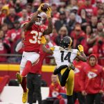 
              Kansas City Chiefs cornerback Charvarius Ward (35) intercepts a pass intended for Pittsburgh Steelers wide receiver Ray-Ray McCloud (14) during the first half of an NFL football game Sunday, Dec. 26, 2021, in Kansas City, Mo. (AP Photo/Charlie Riedel)
            