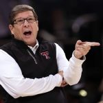 
              Texas Tech coach Mark Adams gestures during the first half of the team's NCAA college basketball game against Tennessee in the Jimmy V Classic on Tuesday, Dec. 7, 2021, in New York. (AP Photo/Adam Hunger)
            