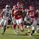 
              Kansas City Chiefs running back Clyde Edwards-Helaire (25) heads for the end zone to score past Las Vegas Raiders defensive tackle Johnathan Hankins (90) and linebacker Divine Deablo (5) during the first half of an NFL football game Sunday, Dec. 12, 2021, in Kansas City, Mo. (AP Photo/Charlie Riedel)
            