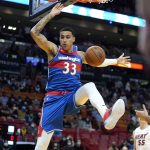 
              Washington Wizards forward Kyle Kuzma (33) dunks during the first half of an NBA basketball game against the Miami Heat, Tuesday, Dec. 28, 2021, in Miami. (AP Photo/Lynne Sladky)
            