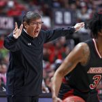 
              Texas Tech coach Mark Adams yells out while Arkansas State's Desi Sills (3) dribbles the ball during the first half of an NCAA college basketball game on Tuesday, Dec. 14, 2021, in Lubbock, Texas. (AP Photo/Brad Tollefson)
            