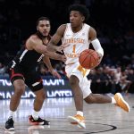 
              Tennessee guard Kennedy Chandler (1) drives past Texas Tech forward Kevin Obanor during the first half of an NCAA college basketball game in the Jimmy V Classic on Tuesday, Dec. 7, 2021, in New York. (AP Photo/Adam Hunger)
            