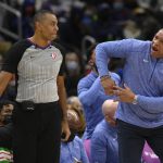 
              Philadelphia 76ers head coach Doc Rivers, right, gestures to referee Karl Lane, left, during the second half of an NBA basketball game against the Washington Wizards, Sunday, Dec. 26, 2021, in Washington. The 76ers won 117-96. (AP Photo/Nick Wass)
            