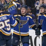 
              St. Louis Blues' Vladimir Tarasenko, center, is congratulated by Jordan Kyrou (25) and Robert Thomas (18) after scoring during the second period of an NHL hockey game against the Edmonton Oilers Wednesday, Dec. 29, 2021, in St. Louis. (AP Photo/Jeff Roberson)
            