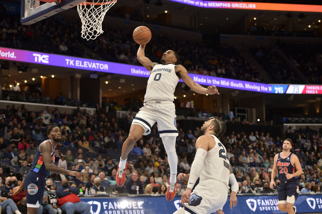 Memphis Grizzlies guard De'Anthony Melton (0) goes up for a dunk in the second half of an NBA baske...