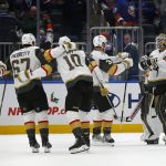 
              Vegas Golden Knights' Zach Whitecloud (2), Max Pacioretty (67), Nicolas Roy (10) and Brayden McNabb (3) celebrate with goalie Robin Lehner (90) during an NHL hockey game against the New York Islanders, Sunday, Dec. 19, 2021, in Elmont, N.Y. (AP Photo/John Munson)
            