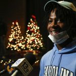 
              Green Run High School cornerback Tayon Holloway is interviewed after signing his national letter of intent for the University of North Carolina during a national signing day event at Green Run High School in Virginia Beach, Va. on Wednesday, Dec. 15, 2021. (Trent Sprague /The Virginian-Pilot via AP)
            