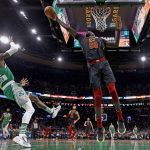 
              Cleveland Cavaliers center Tacko Fall (99) blocks a shot by Boston Celtics' Dennis Schroder during the second quarter of an NBA basketball game Wednesday, Dec. 22, 2021, in Boston. (AP Photo/Winslow Townson)
            