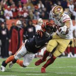 
              San Francisco 49ers' George Kittle (85) is tackled by Cincinnati Bengals' Ricardo Allen (37) during the second half of an NFL football game, Sunday, Dec. 12, 2021, in Cincinnati. (AP Photo/Aaron Doster)
            