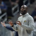 
              Indiana Pacers assistant coach Lloyd Pierce calls a play during the first half of the team's NBA basketball game against the Dallas Mavericks, Friday, Dec. 10, 2021, in Indianapolis. (AP Photo/Darron Cummings)
            