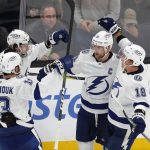 
              Tampa Bay Lightning's Steven Stamkos (91) celebrates with teammates after scoring in overtime during an NHL hockey game against the Boston Bruins, Saturday, Dec. 4, 2021, in Boston. (AP Photo/Michael Dwyer)
            