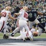 
              Seattle Seahawks defensive end Carlos Dunlap (8) sacks San Francisco 49ers quarterback Jimmy Garoppolo (10) in the end zone for a safety to tie the game during the second half of an NFL football game, Sunday, Dec. 5, 2021, in Seattle. (AP Photo/John Froschauer)
            