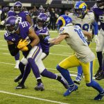 
              Minnesota Vikings outside linebacker Anthony Barr (55) intercepts a pass ahead of Los Angeles Rams wide receiver Cooper Kupp, right, during the second half of an NFL football game, Sunday, Dec. 26, 2021, in Minneapolis. (AP Photo/Jim Mone)
            