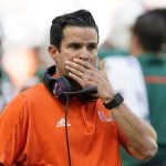 
              FILE - Miami head coach Manny Diaz looks on as officials review a play during the first half of an NCAA college football game against Georgia Tech, Saturday, Nov. 6, 2021, in Miami Gardens, Fla. Manny Diaz was fired as Miami’s football coach Monday, Dec. 6, 2021, after a 7-5 regular season and with the school in deep negotiations to bring Oregon coach Mario Cristobal back to his alma mater to take over. (AP Photo/Wilfredo Lee, File)
            