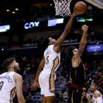 
              New Orleans Pelicans forward Herbert Jones (5) blocks a shot by Cleveland Cavaliers guard Ricky Rubio (3) during the first quarter of an NBA basketball game in New Orleans, Tuesday, Dec. 28, 2021. (AP Photo/Derick Hingle)
            