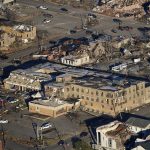 
              FILE - In this aerial photo, destruction from a recent tornado is seen in downtown Mayfield, Ky., Sunday, Dec. 12, 2021. According to a study presented at the American Geophysical Union conference on Monday, Dec. 13, 2021, nasty winter tornadoes _ like the deadly one last week that hit five states _ are likely to be stronger and stay on the ground longer with a wider swath of destruction in a warming world. (AP Photo/Gerald Herbert)
            