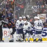 
              Toronto Maple Leafs players celebrate a goal on Edmonton Oilers goalie Mikko Koskinen (19) during the second period of an NHL hockey game Tuesday, Dec. 14, 2021 in Edmonton, Alberta  (Jason Franson/The Canadian Press via AP)
            