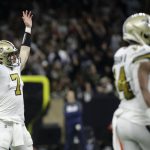 
              New Orleans Saints quarterback Taysom Hill (7) celebrates a touchdown against the Dallas Cowboys during the first half of an NFL football game, Thursday, Dec. 2, 2021, in New Orleans. (AP Photo/Derick Hingle)
            