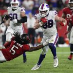 
              Buffalo Bills tight end Dawson Knox (88) slips a tackle by Tampa Bay Buccaneers cornerback Richard Sherman (5) during the second half of an NFL football game Sunday, Dec. 12, 2021, in Tampa, Fla. (AP Photo/Mark LoMoglio)
            