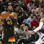 
              Utah Jazz guard Donovan Mitchell (45) looks to pass as San Antonio Spurs guard Dejounte Murray (5) defends during the first half of an NBA basketball game on Friday, Dec. 17 2021, in Salt Lake City. (AP Photo/Kim Raff)
            