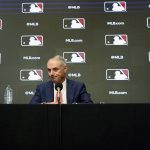 
              Major League Baseball commissioner Rob Manfred pauses during a news conference in Arlington, Texas, Thursday, Dec. 2, 2021. Owners locked out players at 12:01 a.m. Thursday following the expiration of the sport's five-year collective bargaining agreement. (AP Photo/LM Otero)
            