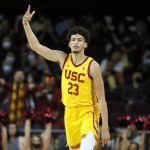 
              Southern California forward Max Agbonkpolo celebrates after shooting a three-pointer against Long Beach State during the second half of an NCAA college basketball game in Los Angeles, Sunday, Dec. 12, 2021. (AP Photo/Alex Gallardo)
            
