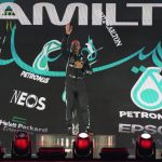 
              Mercedes driver Lewis Hamilton of Britain waves from the podium after winning the Formula One Saudi Arabian Grand Prix in Jiddah, Sunday, Dec. 5, 2021. Left is second placed Red Bull driver Max Verstappen of the Netherlands and Ron the right is third, Mercedes driver Valtteri Bottas of Finland. (AP Photo/Hassan Ammar)
            
