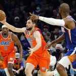 
              Oklahoma City Thunder guard Ty Jerome (16) steals the ball as Phoenix Suns guard Chris Paul, right, runs back on defense while Thunder guard Paul Watson (8) looks on during the first half of an NBA basketball game Wednesday, Dec. 29, 2021, in Phoenix. (AP Photo/Ross D. Franklin)
            