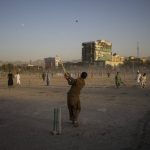 
              Afghans play cricket at the Chaman-e-Hozari Park in Kabul, Afghanistan, Sept. 17, 2021. (AP Photo/Bernat Armangue)
            