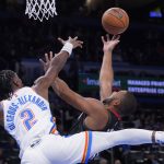 
              Houston Rockets guard Eric Gordon, right, shoots in front of Oklahoma City Thunder guard Shai Gilgeous-Alexander (2) during the first half of an NBA basketball game Wednesday, Dec. 1, 2021, in Oklahoma City. (AP Photo/Sue Ogrocki)
            