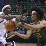 
              Baylor guard Kendall Brown, right, is guard by Alcorn State center Lenell Henry, left, in the first half of an NCAA college basketball game, Monday, Dec. 20, 2021, in Waco, Texas. (AP Photo/Rod Aydelotte)
            