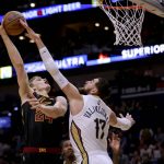
              New Orleans Pelicans center Jonas Valanciunas (17) blocks a shot attempt by Cleveland Cavaliers forward Lauri Markkanen (24) during the first quarter of an NBA basketball game in New Orleans, Tuesday, Dec. 28, 2021. (AP Photo/Derick Hingle)
            